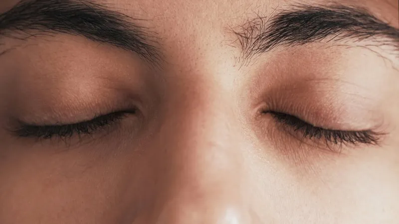 closed eyes mind relaxation spiritual meditation mindfulness serenity closeup of peaceful tranquil calm male face with dark eyelashes eyebrows