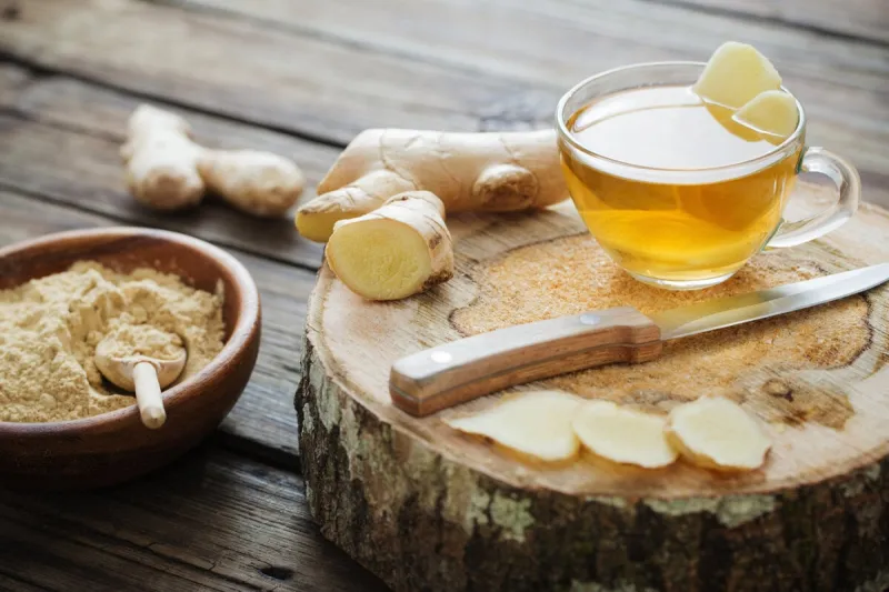 ginger tea on old wooden background