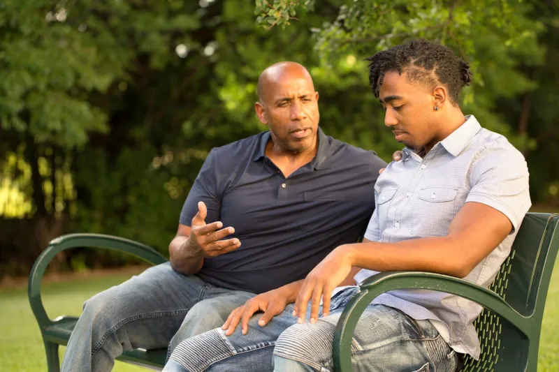 portrait of an african american father and his son