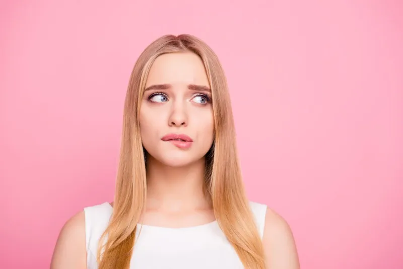problem trouble negative nervous sad unhappy upset people concept close up portrait of sweet charming tender gentle nervous beautiful attractive elegant stunning girl looking side isolated background