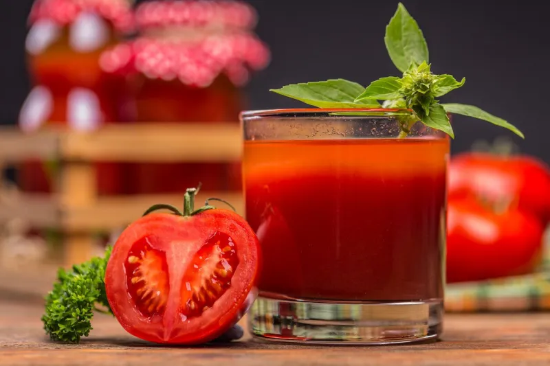 close up of tomato juice in glass