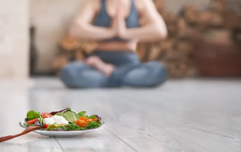 young woman do yoga healthy food after a workout