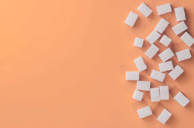 white sugar on pink background