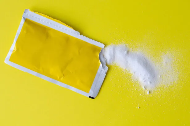 rehydration treatment sachet on yellow background oral rehydration salts top view