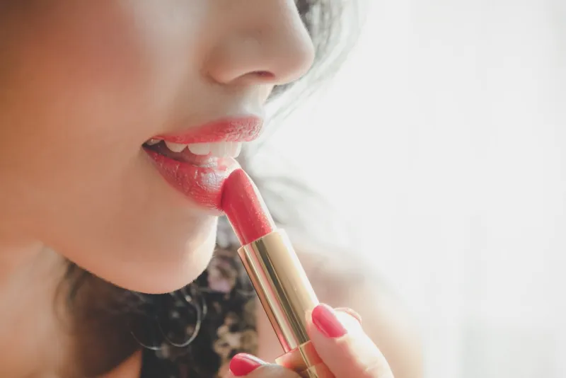 close up beautiful luxury young woman applying lip liner to nude red lips close up shot and make up cosmetic of woman putting lipstick on her lip
