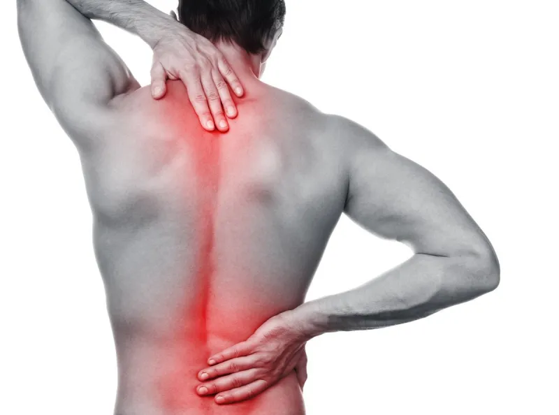 man with pain in his back over white background