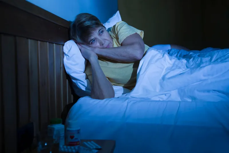 insomnia healthy sleep senior healthy lifestyle elderly woman suffers from insomnia at night lying in bed