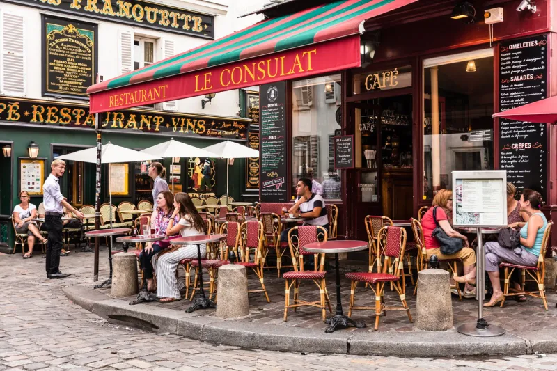 paris, france - july 06, 2017  the charming restaurant le consulat on the montmartre hill parisians and tourists enjoy food and drinks montmartre with traditional french cafes and art galleries is one of the most visited landmarks in paris