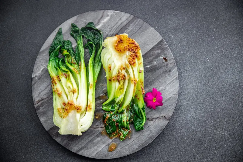 bok choy or pak choy dish , chinese cabbage vegetable healthy meal food snack on the table copy space food background rustic top view