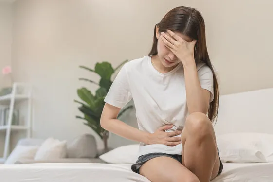 flatulence ulcer, asian young woman, girl hands in belly, stomachache from food poisoning, abdominal pain and digestive problem, gastritis or diarrhoea abdomen inflammation, menstrual period people