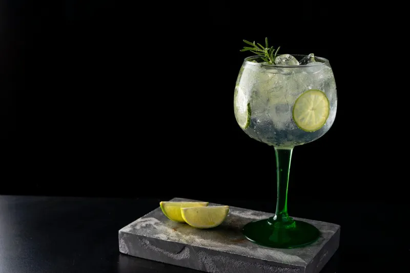 gin tonic cocktail is on the bar space for text photo for the menu