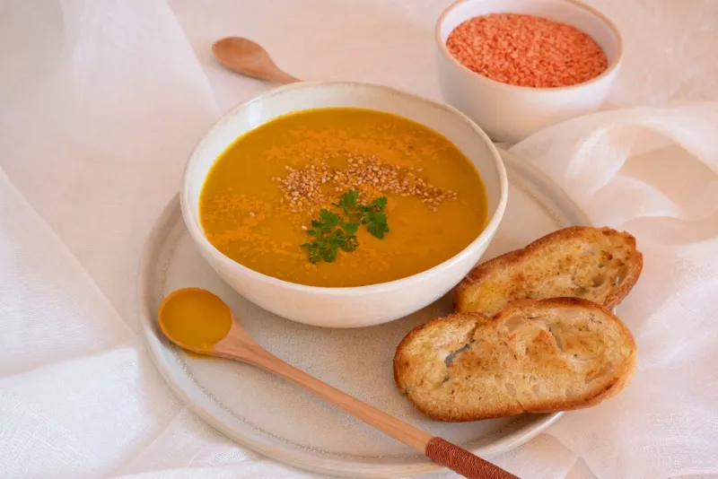 orange soup in a bowl, pumpkin, carrot or coral lentils