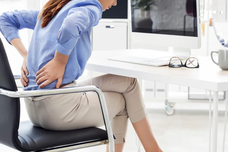 businesswoman with pain in back