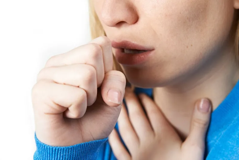 close up of woman suffering with cough