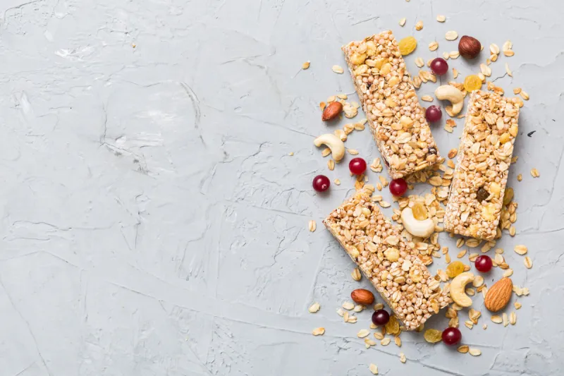 various granola bars on table background cereal granola bars superfood breakfast bars with oats, nuts and berries, close up superfood concept