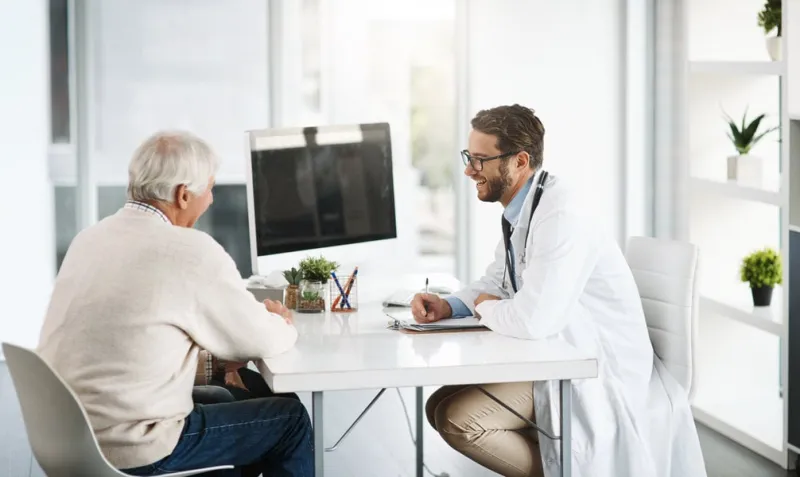 i will do everything in my power to help you cropped shot of a confident young male doctor consulting a senior patient inside of the doctors office