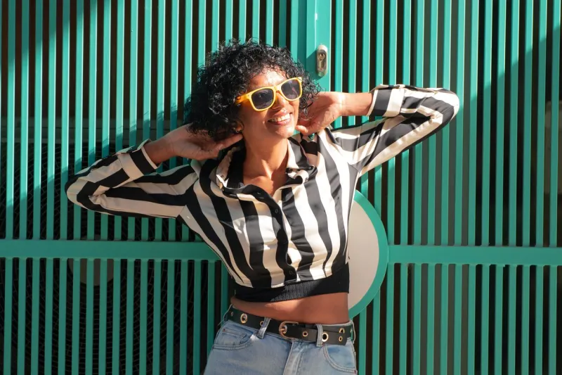 woman with sunglasses on the street in summer