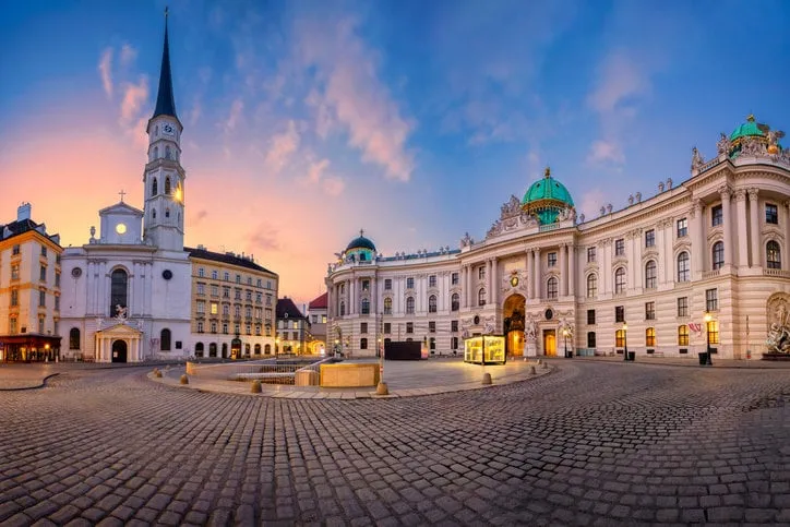 cityscape image of vienna, austria with st michael's square during sunrise