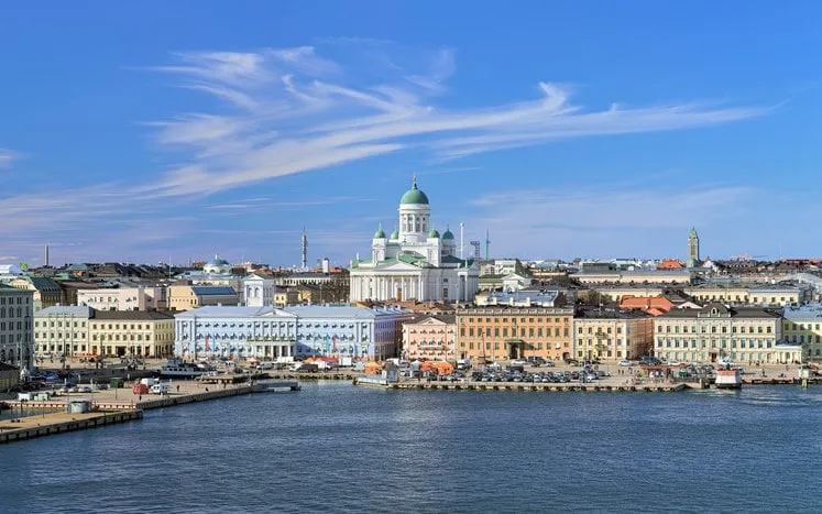 helsinki, finland scenic cityscape with helsinki cathedral, south harbor, market square (kauppatori) and beautiful cirrus clouds over them in the sunny spring day