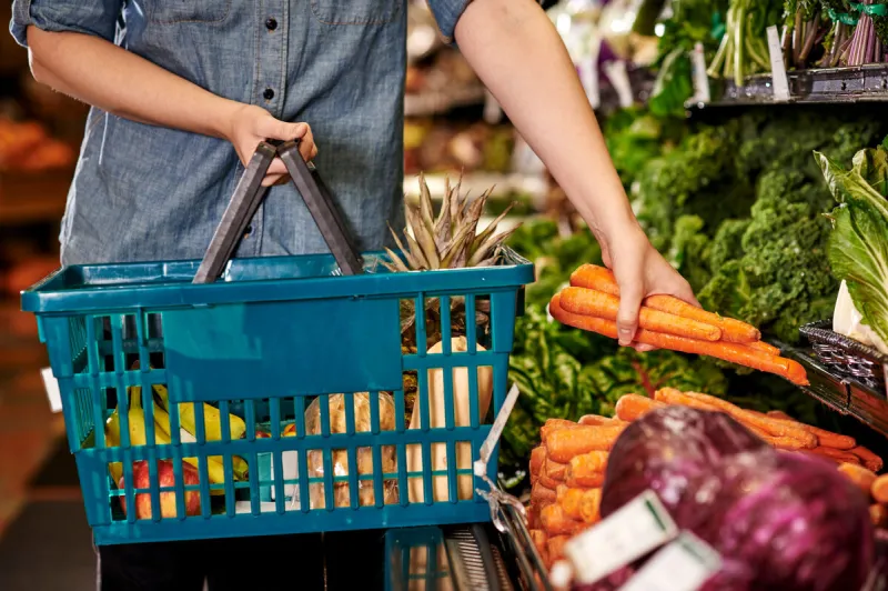 a woman shopping at a grocery store