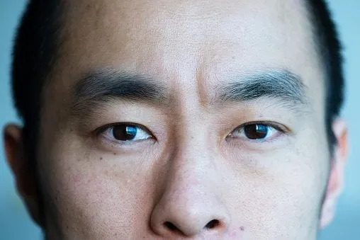 closeup portrait of a japanese man in his 30s