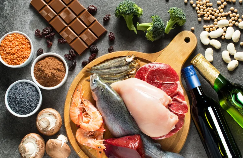 high purine foods foods that contain high levels of purines as trout, shrimps, chicken breast, red meat, sprats, liver, beans, chocolate, lentils, mushrooms, beer, vine, cocoa, raisins, broccoli, soy, poppy seed