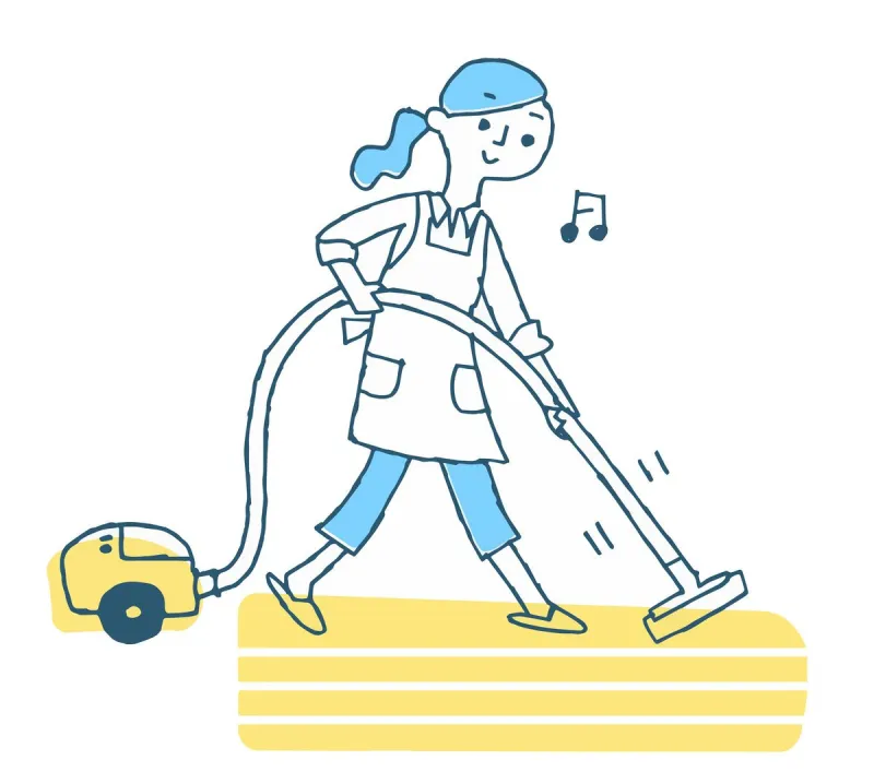 掃除機で掃除する女性