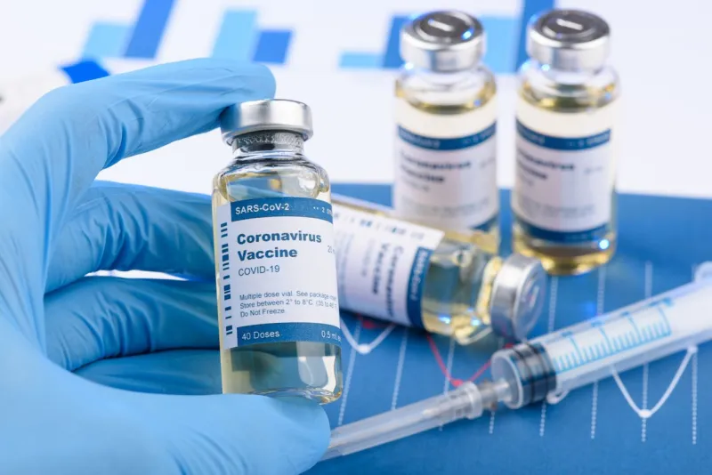 coronavirus covid-19 vaccine vial and injection syringe in scientist hands concept research for new novel corona virus vaccination immunization drug