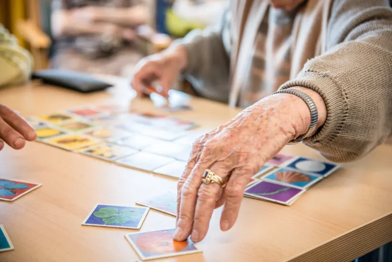 senior woman is playing memory