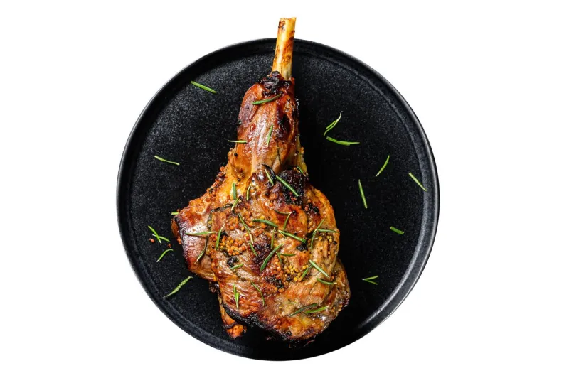 oven baked lamb leg  isolated, white background