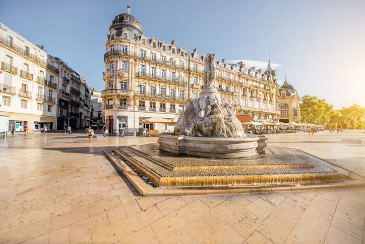 view on the comedy square with fountain of three graces during the morning light in montpellier city in southern france