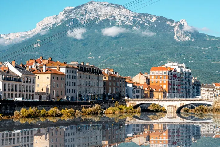 morning cityscape view with mountains, river and bridge in grenoble city on the south-east of france