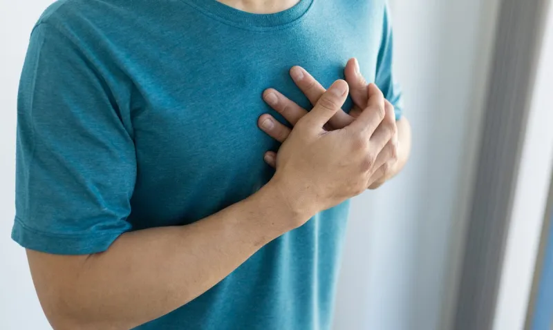 man has chest pain concept of recurrent heart disease and lung disease