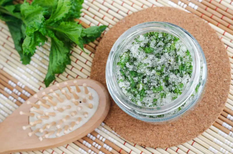 homemade mint exfoliating scrub (scalp peeling, bath salt) with sugar, chopped mint leaves, olive oil and essential mint oil natural skin and hair care diy beauty treatments, spa recipe