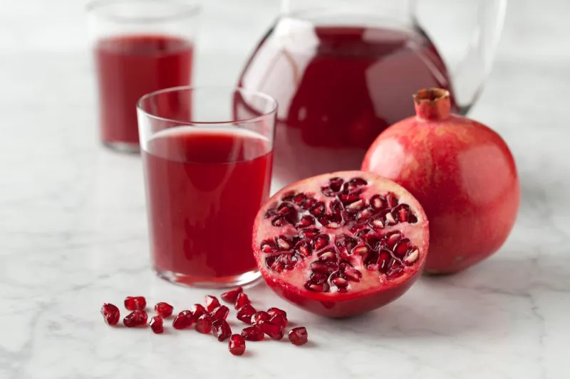 fresh pomegranate juice in a jar