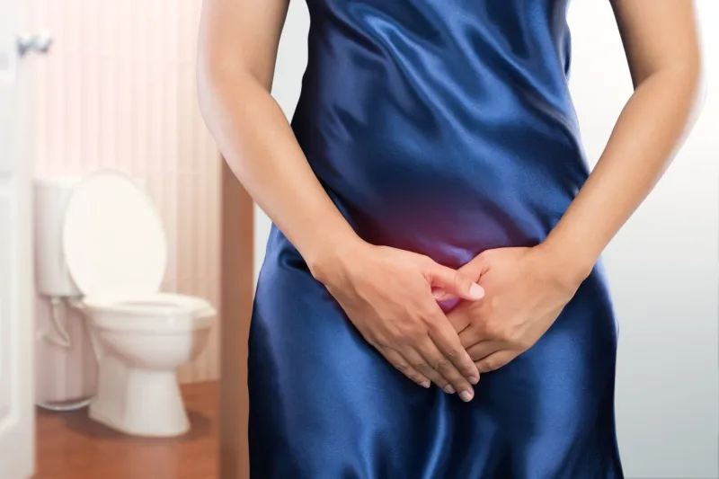 woman with prostate problem in front of toilet bowl lady with hands holding her crotch, people wants to pee - urinary incontinence concept
