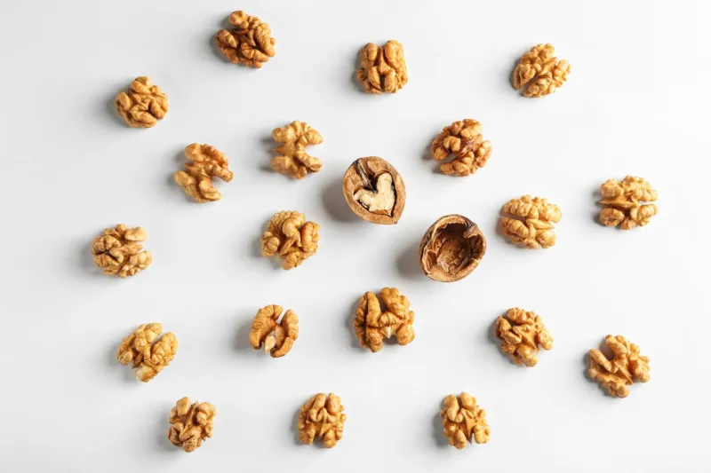 tasty walnuts on white background