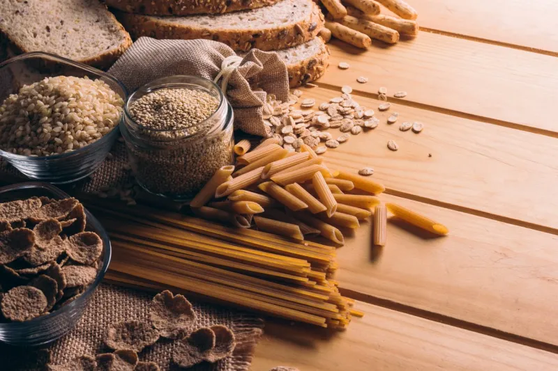 wooden table full of fiber-rich wholegrain foods, perfect for a balanced diet