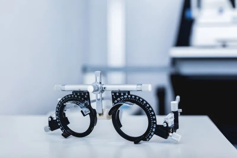 eye test glasses at doctor's office trial frame medical exam equipment, optometry