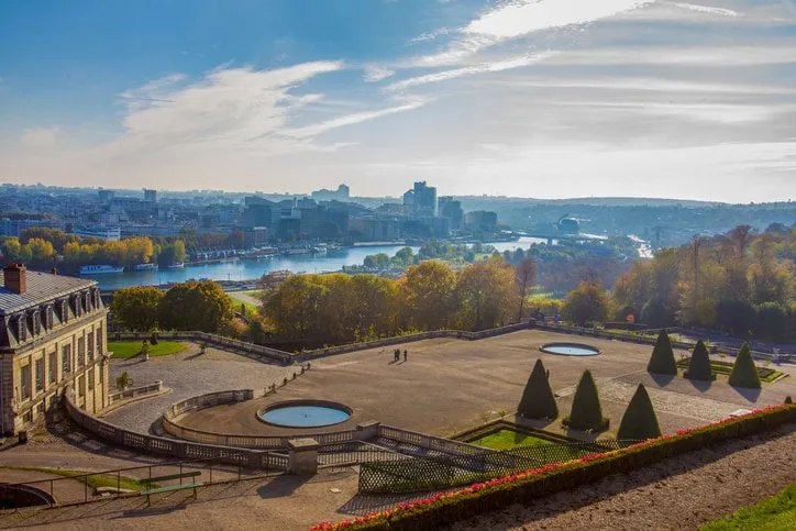 idyllic aerial view on paris   domaine national de saint-cloud and river seine at autumn topiary trees and golden autumn foliage in public park
