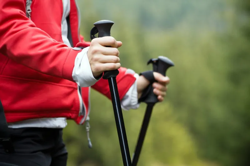 nordic walking in autumn mountains, hiking concept