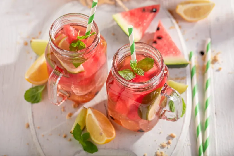 healthy lemonade with melon, citrus and crushed ice mojito with lime and watermelon