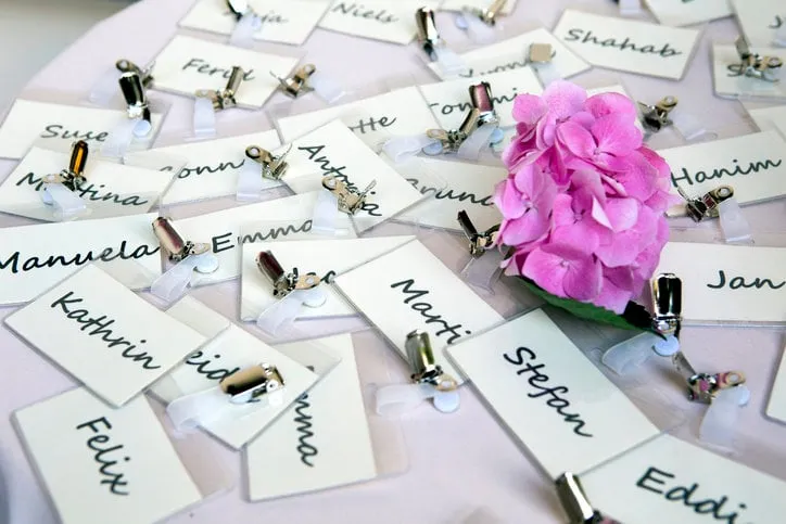 bunch of nametags scattered on a table