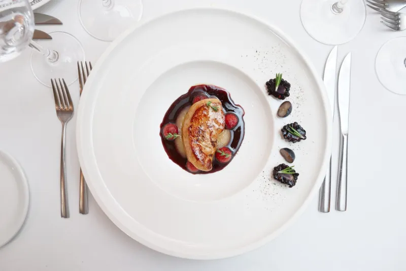 foie gras dish on restaurant table shot from above