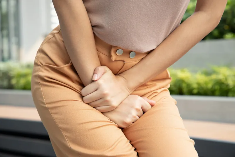 woman holding her pee, health care concept of urinary tract infection, urinary incontinence, overactive bladder symptoms