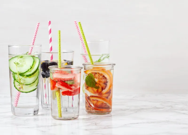 herbs and fruits flavored infused water summer refreshing drink health care, fitness, healthy nutrition diet concept