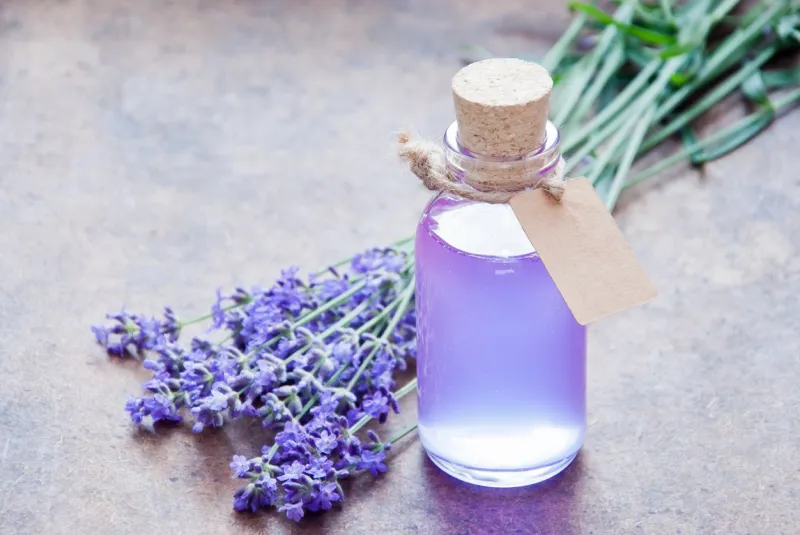 aromatherapy oil and lavender, lavender spa, wellness with lavender, lavender syrup on a wooden background
