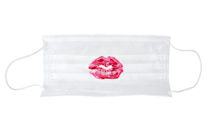 protective medical mask with red lipstick kiss print on white background isolated closeup, nurse lips pattern on disposable respiratory surgical mask, sexy kiss imprint on doctor safety breathing mask