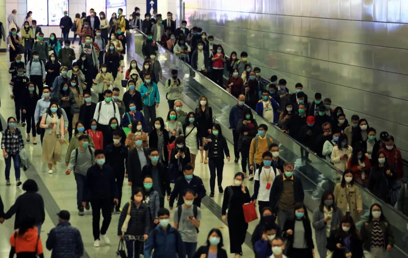hong kong - 3 feberary 2020  people after work go back to home through the central mtr station tunnel central mtr station is the complex largest train station in hong kong