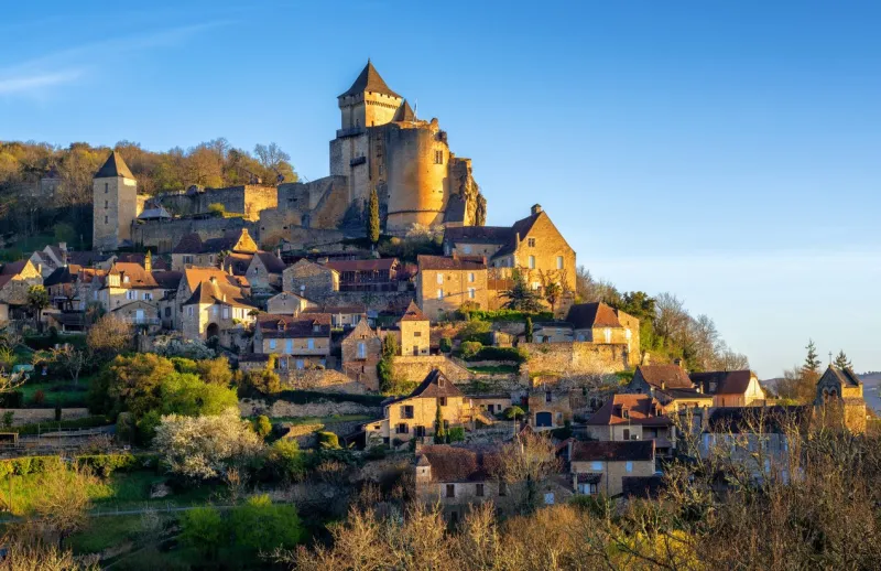 medieval castelnaud-la-chapelle hilltop village with chateau de castelnaud castle, dordogne, perigord noir, france